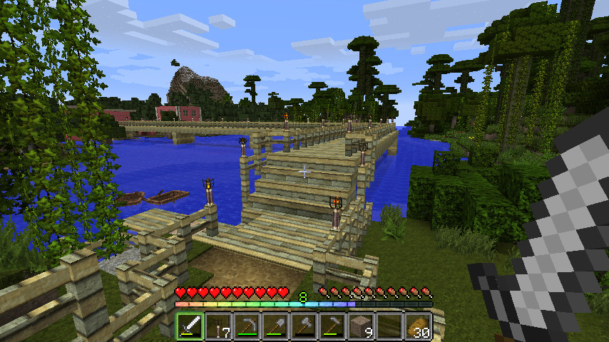 Screenshot from the Minecraft server of a bridge over a lake in a jungle biome